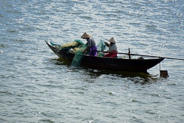 fisherman in the harbour of danang