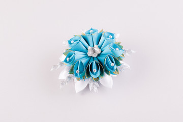 blue and white hair clip in the shape of a flower
