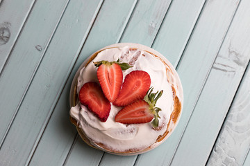 Pancake pie with strawberries. Dessert with cream and berries. National cuisine. Sweet pastries on...