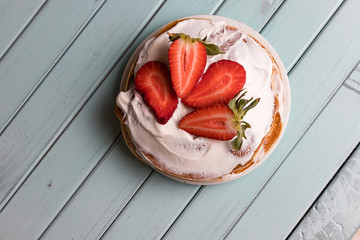 Pancake pie with strawberries. Dessert with cream and berries. National cuisine. Sweet pastries on...