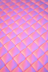 Geometric diamond pattern quilted PU leather in neon light