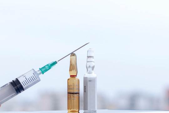 Transparent glass drug ampoules and syringe