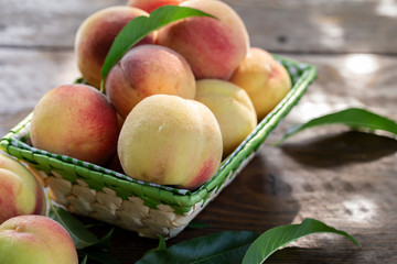 ripe peaches with leaves