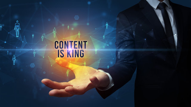Elegant hand holding CONTENT IS KING inscription, social networking concept