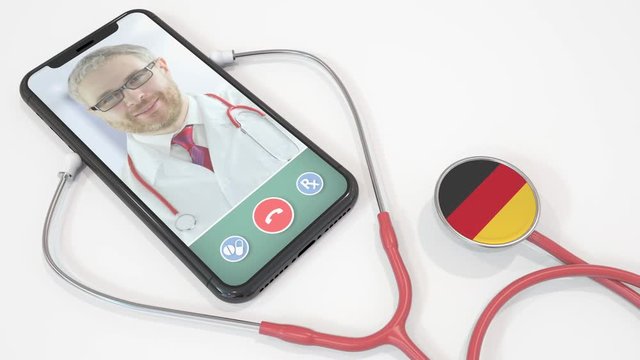 Physician's video call on the phone and stethoscope bell with the German flag. Telemedicine in Germany