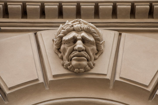 Relief on facade of old building, mascaron ornament