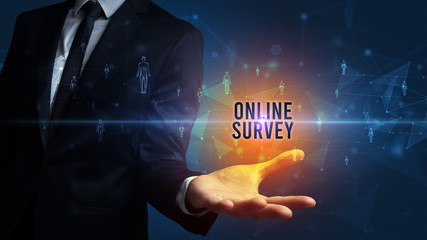 Elegant hand holding ONLINE SURVEY inscription, social networking concept