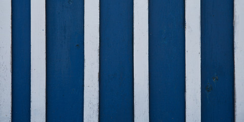 Texture of Dark Blue Wood panel white strip plank background wooden vertical