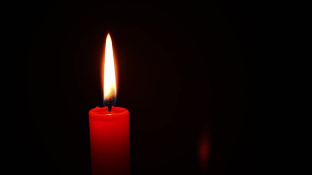 Red burning candle 4K time-lapse movie