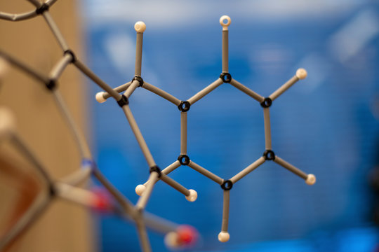 Assembly of comples organic molecule structure with blur background for understanding of chemistry