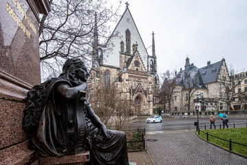 Leipzig, Germany, 01-07-2020 West portal of the famous St. Thomas Church with Monument of Felix...