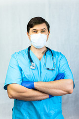 Portrait of Adult handsome physician wearing medical robe