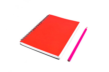 Pink pencil beside a red color covered single note paper diary isolated on a white background