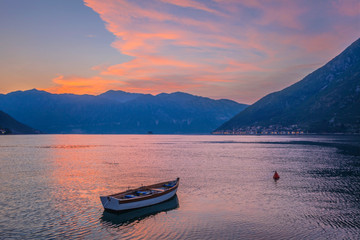  boat in the sea at sunset