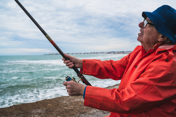 Senior man fishing in the sea.