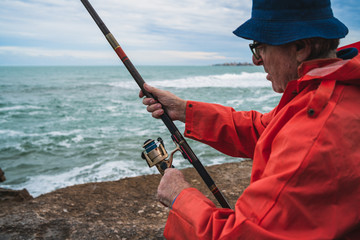 Senior man fishing in the sea.