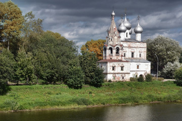 Fototapeta na wymiar Ancient church on the river bank in Vologda