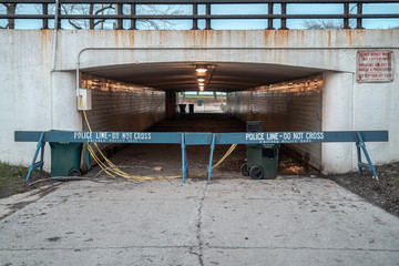 Two blue wooden police barricades block the underpass below Lake Shore Drive leading to the lakefront which was closed during the COVID-19 pandemic and outbreak to help flatten the curve.