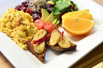 food, fried eggs with vegetables and toast on a plate