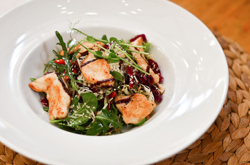 food, salad with meat, spinach and arugula and sausage