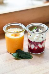 dessert: berry sarber with whipped cream and mint