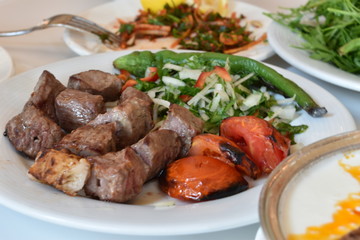 Kebab served with cooked vegetables in one of the best restaurants in Gaziantep