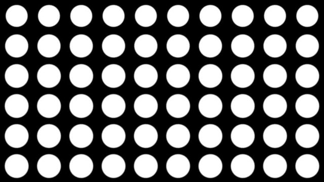 Seamless halftone white dots appear and disappear in motion at black background. Vintage pattern animation.