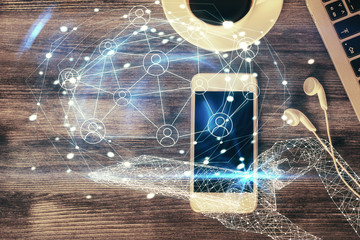Double exposure of social network theme drawing over table with phone. Top view. People connecting concept.