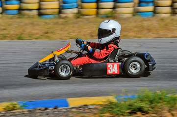 Young go cart racer on circuit