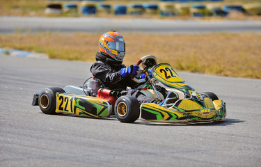 Young go cart racer on circuit