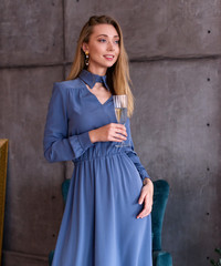 young woman in a blue dress