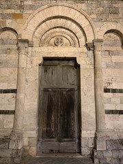 Old Italian wooden doors with brink and stone
