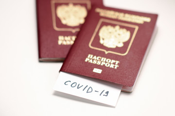 Coronavirus COVID-19 and tourism. Passport, COVID-19 inscription for travel. Quarantine. Restriction for tourists. Covid19 Corona virus disease danger pandemic spread worldwide global