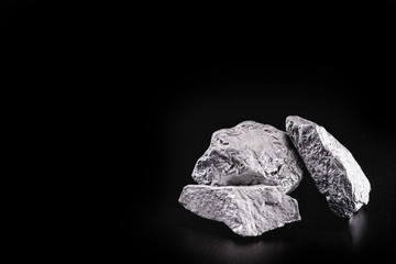 silver nugget native to Liberia isolated on black background.