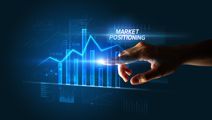 Hand touching MARKET POSITIONING button, business concept