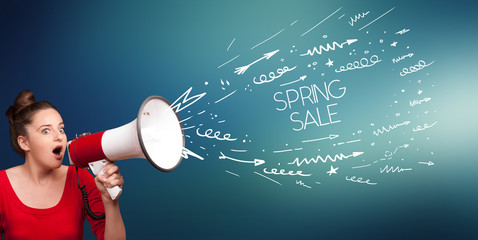 Young girl screaming to megaphone with SPRING SALE inscription, shopping concept