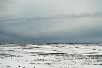 Obraz premium Sunrise on the black sand beach in Iceland in winter, Reynisfjara 