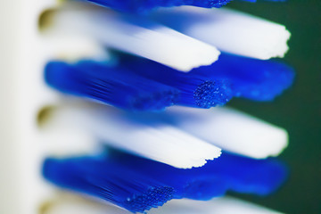 Close up of white and blue toothbrush's bristles