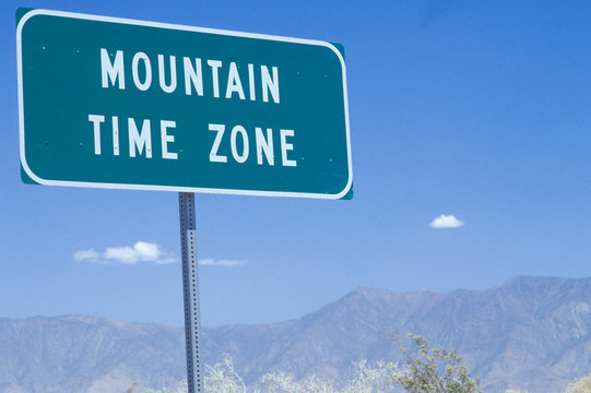 A sign that reads &Ograve;Mountain Time Zone&Oacute;