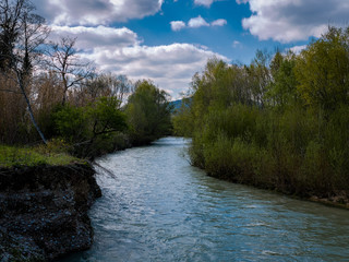 The sky, the clouds, the river and the forest