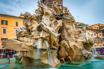Fototapeta na wymiar Rome, Italy. Fountain of Four Rivers (Fontana dei Quattro Fiumi) in Piazza Navona. 4 river gods sculptures of major rivers of papal authority continents. Nile, Danube, Ganges, Plata
