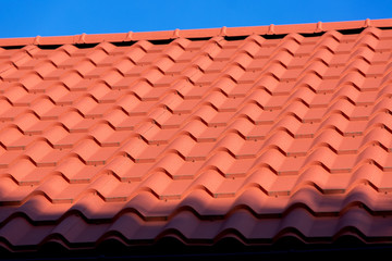 new clean orange roof tiles, close up.