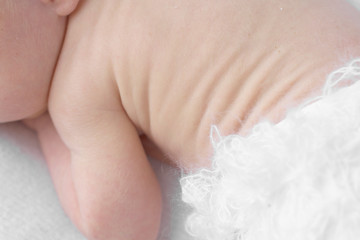 close up of back wrinkles on newborn baby