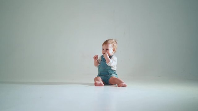 the baby is crawling. studio slow motion.