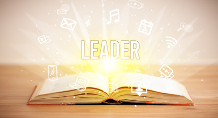 Opeen book with LEADER inscription, business concept
