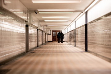people walking in the corridor