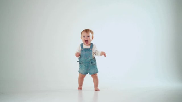 baby 10 months first successful steps, but not solved. studio slow motion