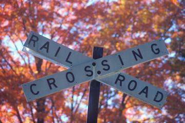 A sign that reads &Ograve;Railroad crossing&Oacute;