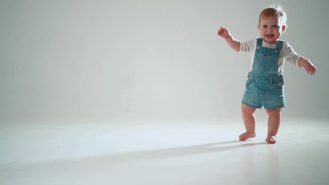 the child tries to go, but falls. studio slow motion