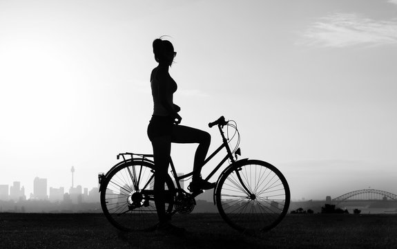 Black and white photo of a cyclist girl, Sydney Australia